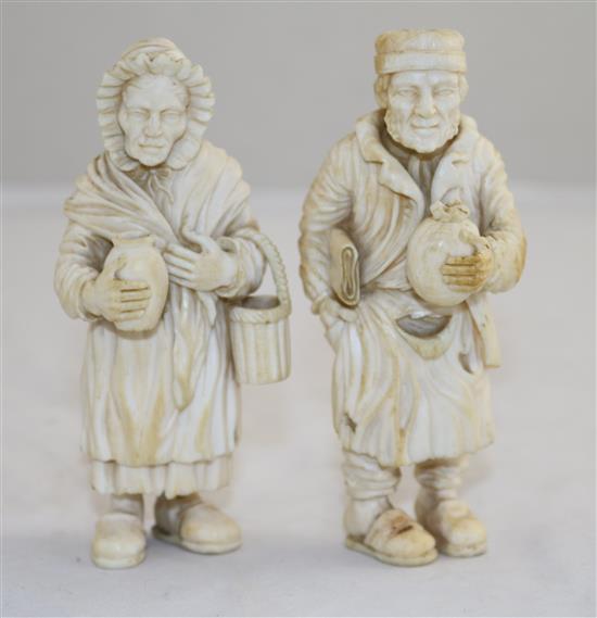 A pair of 19th century Dieppe ivory carvings of an elderly man and woman, 4.25in.